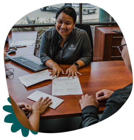 Gather team member speaking to a couple