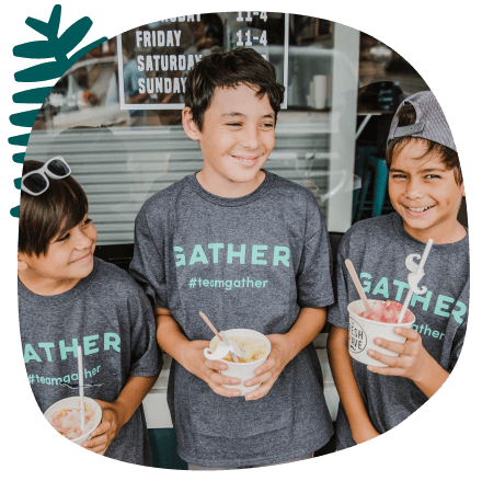 Three boys with shaved ice outside