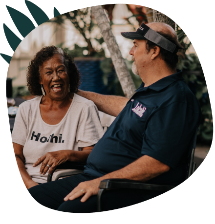 Mature couple laughing on a bench